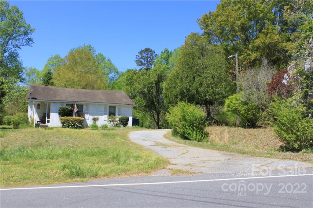 530 Edwards St Extension Rutherfordton, NC 28139 - Photo 7 of 48 a front view of a house with a yard and garage
