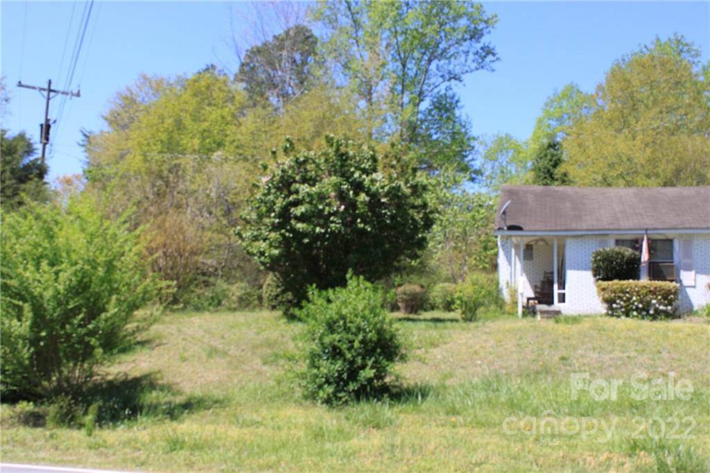 530 Edwards St Extension Rutherfordton, NC 28139 - Photo 10 of 48 a view of a yard in front of a house with large windows