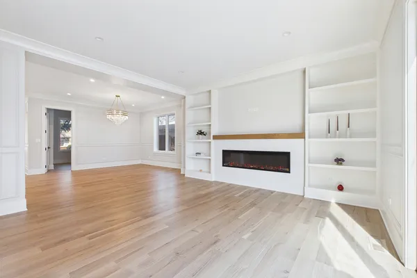 a kitchen with a sink a stove a refrigerator and a wooden cabinets