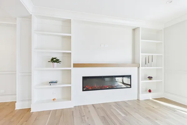a kitchen with stainless steel appliances granite countertop a sink a stove and a wooden floors