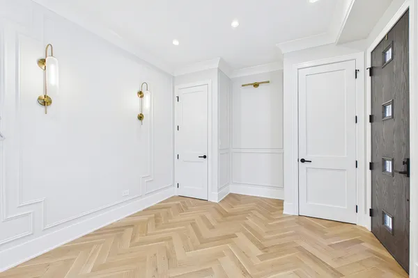 a view of a kitchen with wooden floor and window