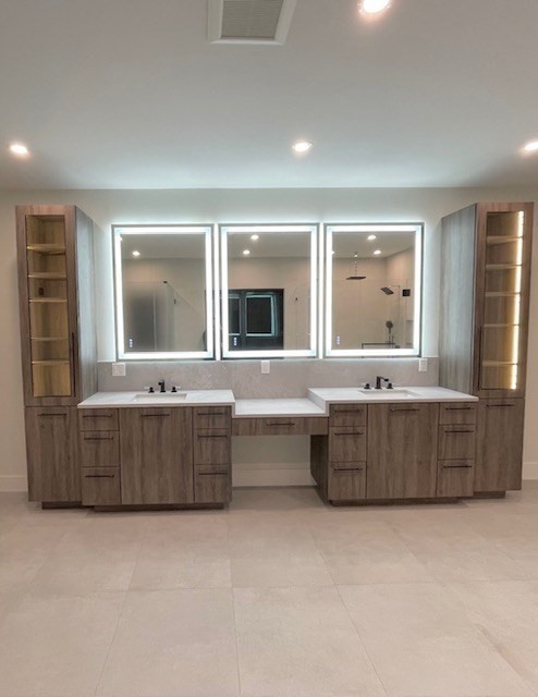 246 Forest Street Needham, MA 02492 - Photo 13 of 32 a bathroom with a tub double vanity sink and mirror