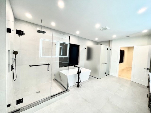 246 Forest Street Needham, MA 02492 - Photo 14 of 32 a large bathroom with a tub and a shower