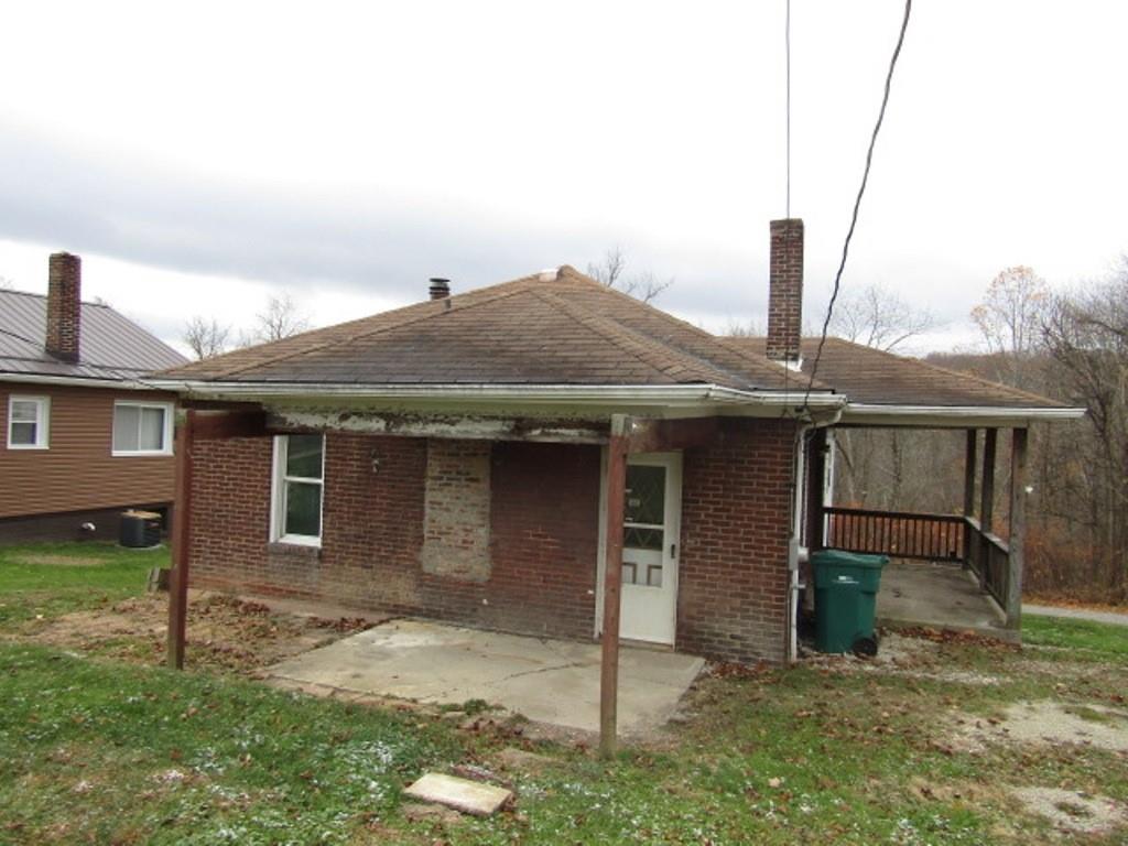 943 Mary Street Langeloth, PA 15054 - Photo 3 of 22 a front view of a house with garden
