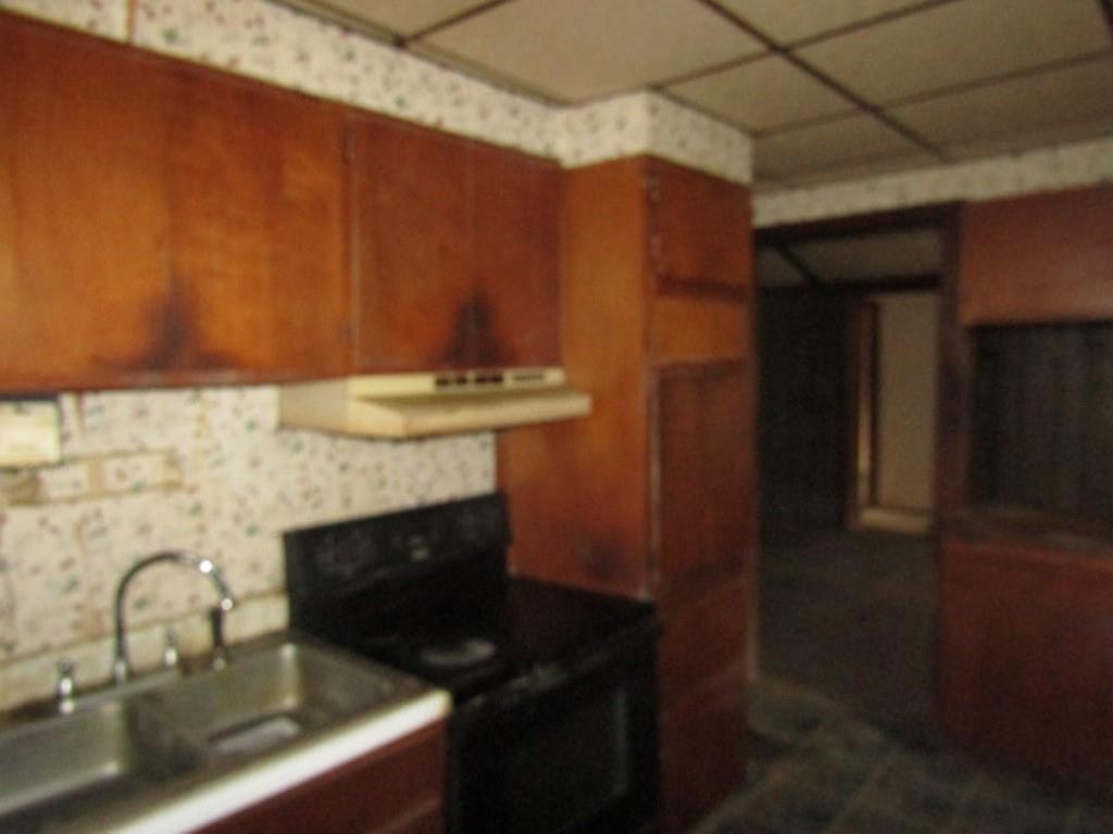 943 Mary Street Langeloth, PA 15054 - Photo 5 of 22 a bathroom with a sink and a mirror