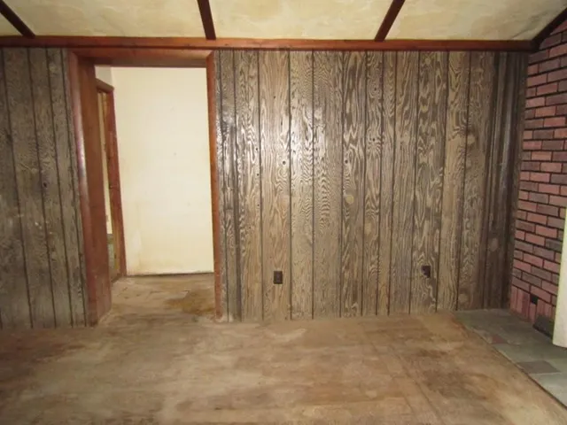 a view of a back yard with a wooden door