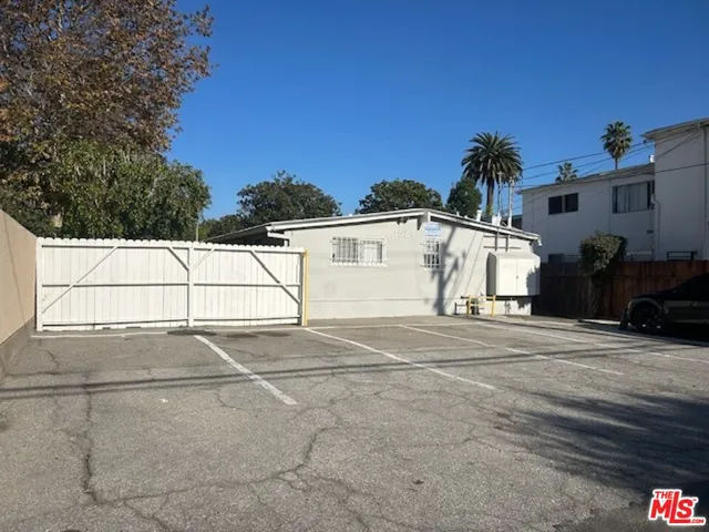 a view of a house with a backyard and a garden