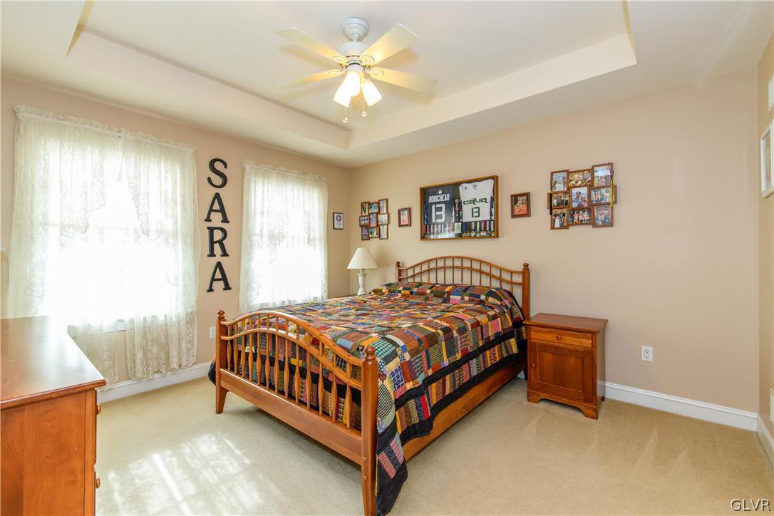577 Lefevre Road Easton, PA 18040 - Photo 15 of 30 a bedroom with a bed and a chandelier