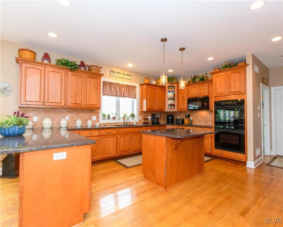 577 Lefevre Road Easton, PA 18040 - Photo 9 of 30 a large kitchen with granite countertop a large counter top stainless steel appliances and cabinets