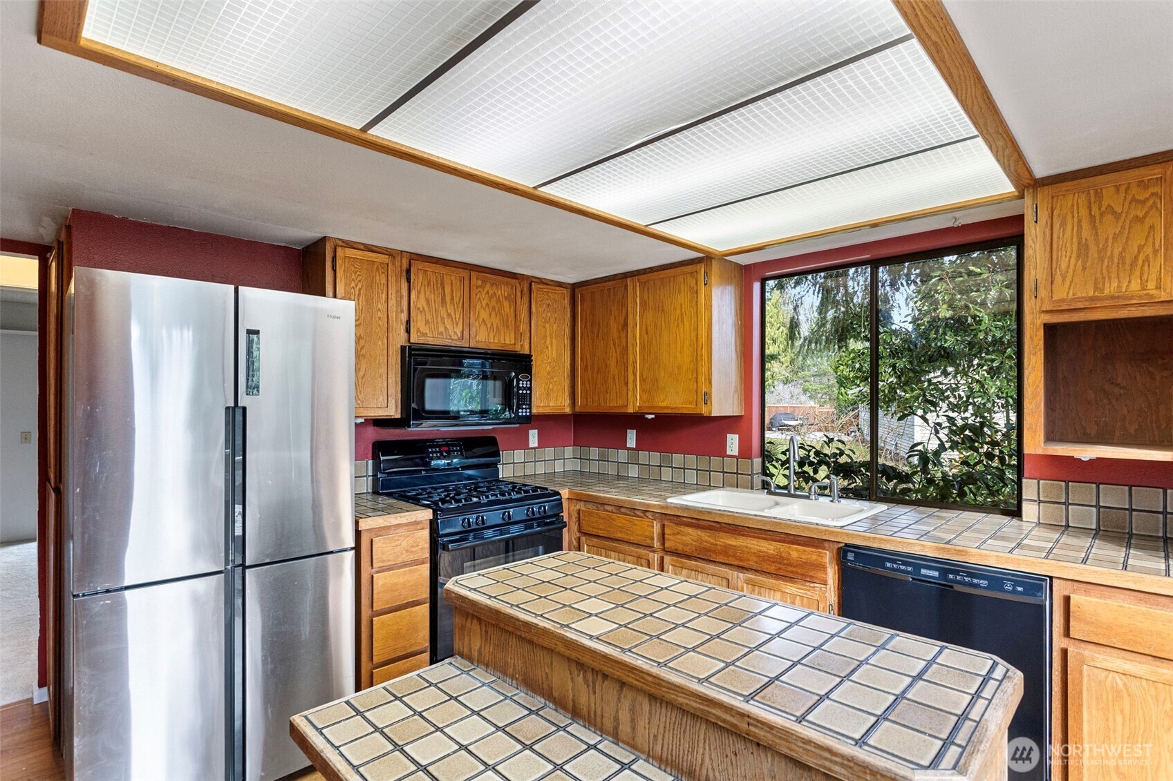 32321 44th Place Southwest Federal Way, WA 98023 - Photo 11 of 37 a kitchen with stainless steel appliances a refrigerator sink and cabinets