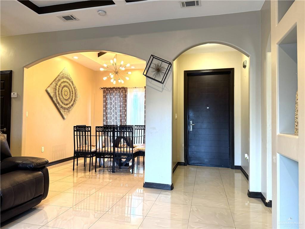 6105 South Mars Lane Pharr, TX 78577 - Photo 18 of 45 a view of a livingroom with furniture and garage
