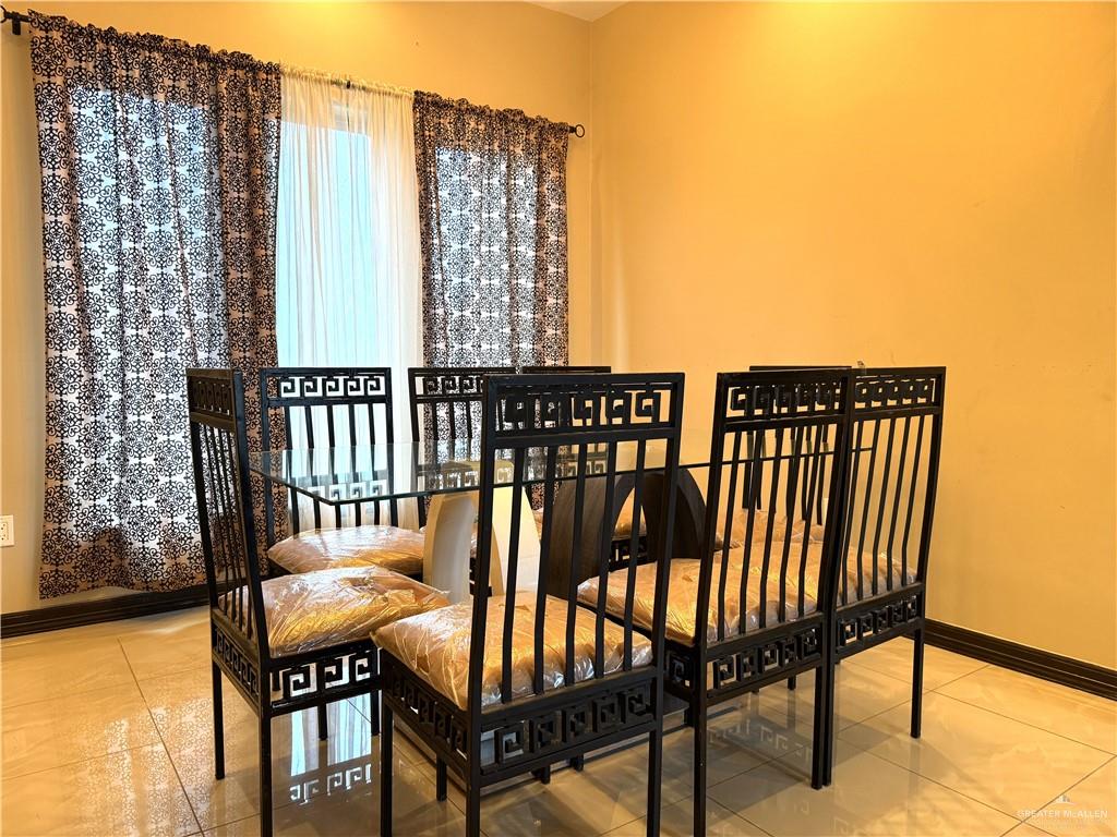 6105 South Mars Lane Pharr, TX 78577 - Photo 19 of 45 a view of balcony with a potted plant and outdoor seating