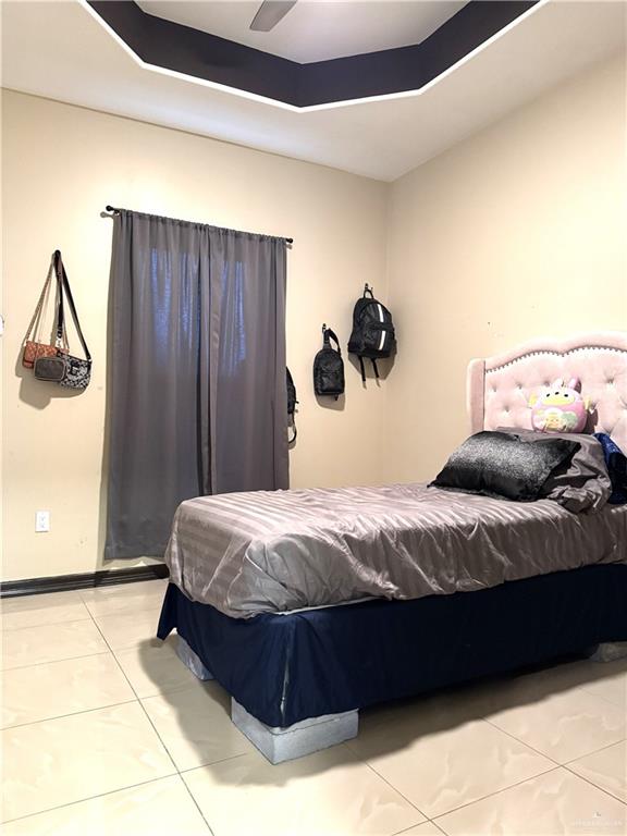 6105 South Mars Lane Pharr, TX 78577 - Photo 37 of 45 a bedroom with a bed and cabinets