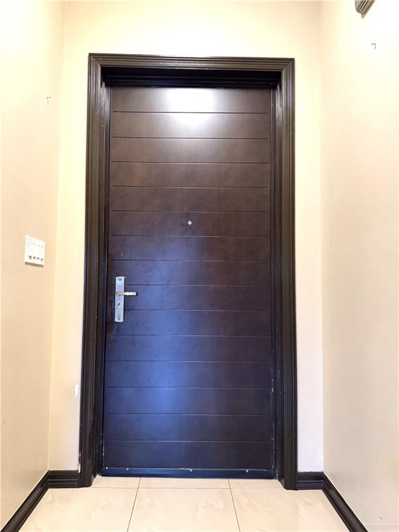 6105 South Mars Lane Pharr, TX 78577 - Photo 45 of 45 a bathroom with a glass door