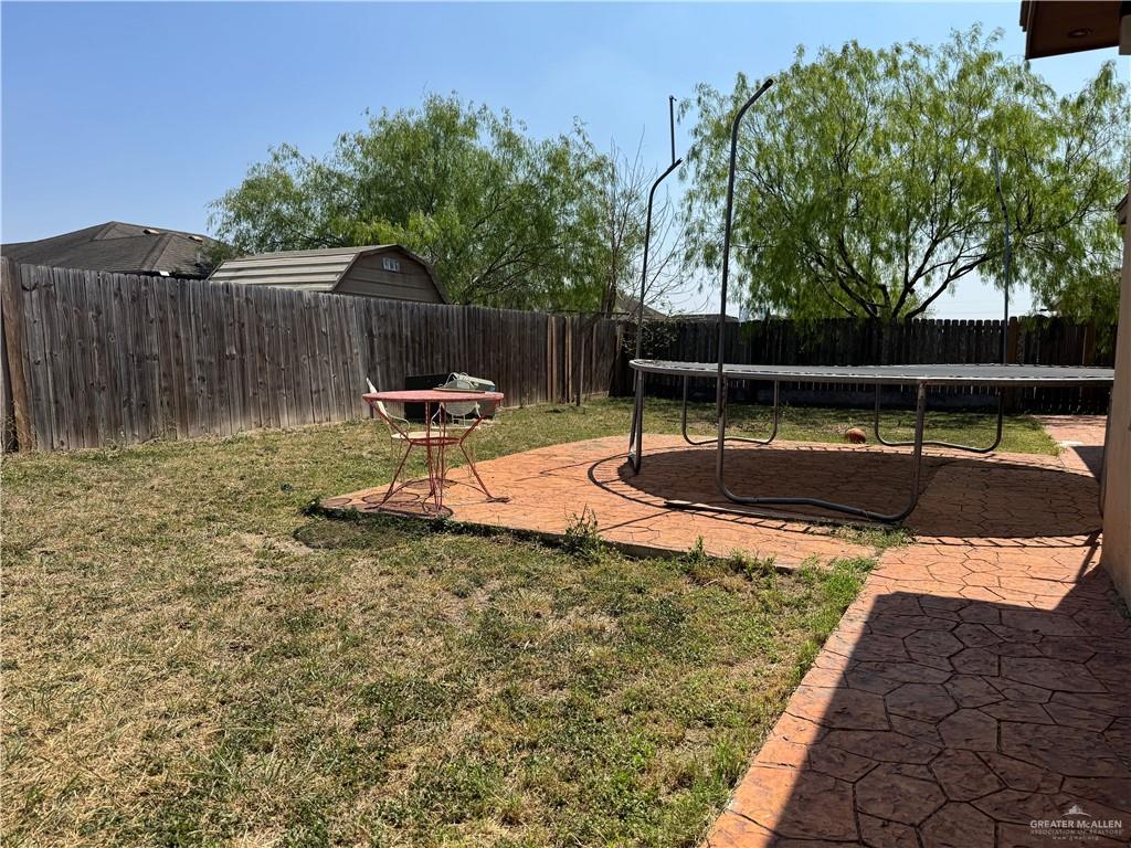 6105 South Mars Lane Pharr, TX 78577 - Photo 8 of 45 a backyard of a house with table and chairs