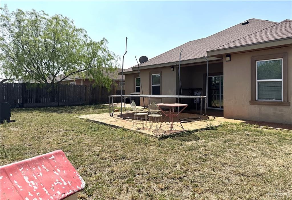 6105 South Mars Lane Pharr, TX 78577 - Photo 10 of 45 a view of a house with backyard and sitting area