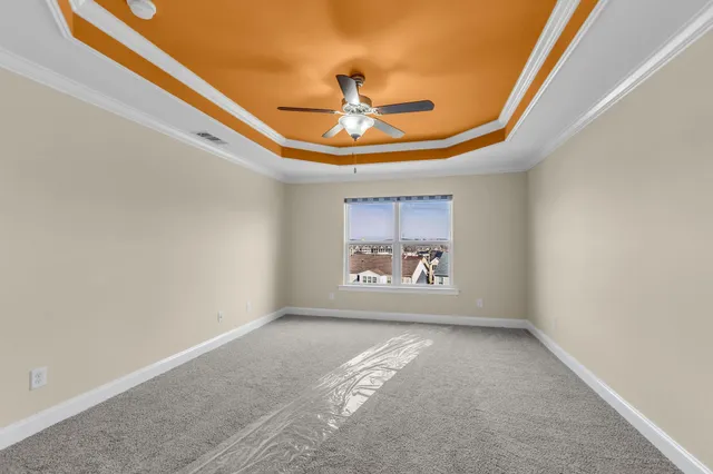 a view of an empty room and wooden floor