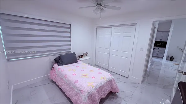 a bedroom with a bed and a closet