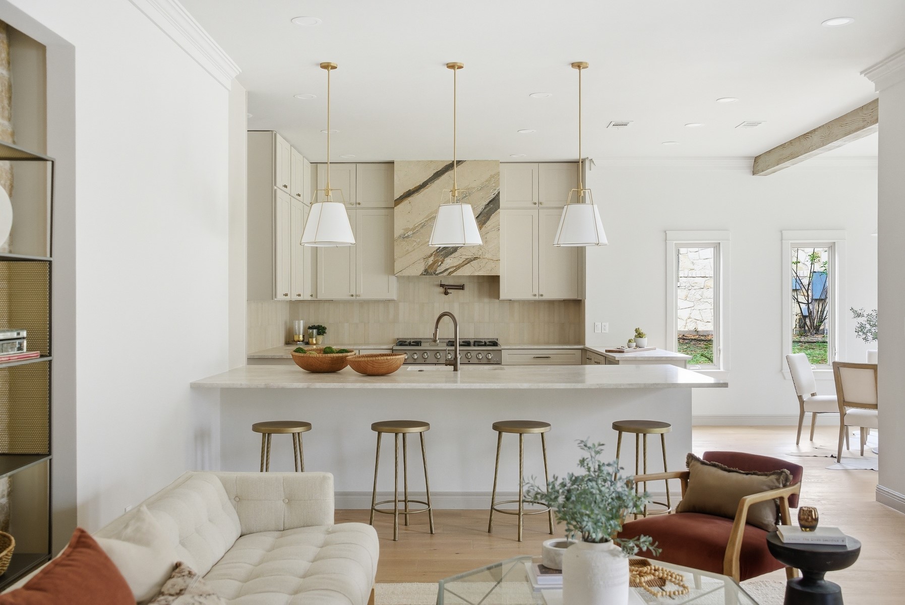 a kitchen with stainless steel appliances granite countertop a sink and a refrigerator