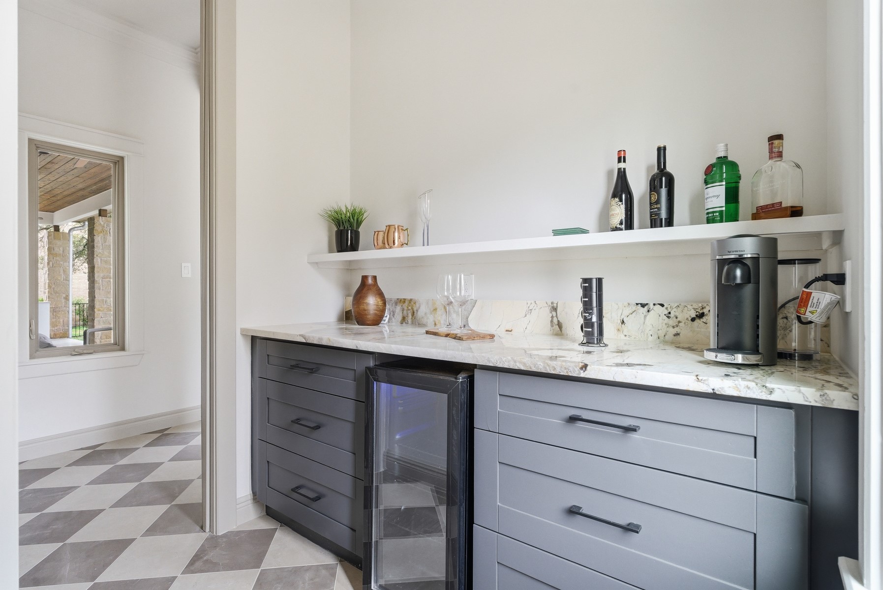 10259 Brangus Road Driftwood, TX 78619 - Photo 19 of 39 a kitchen with cabinets and window