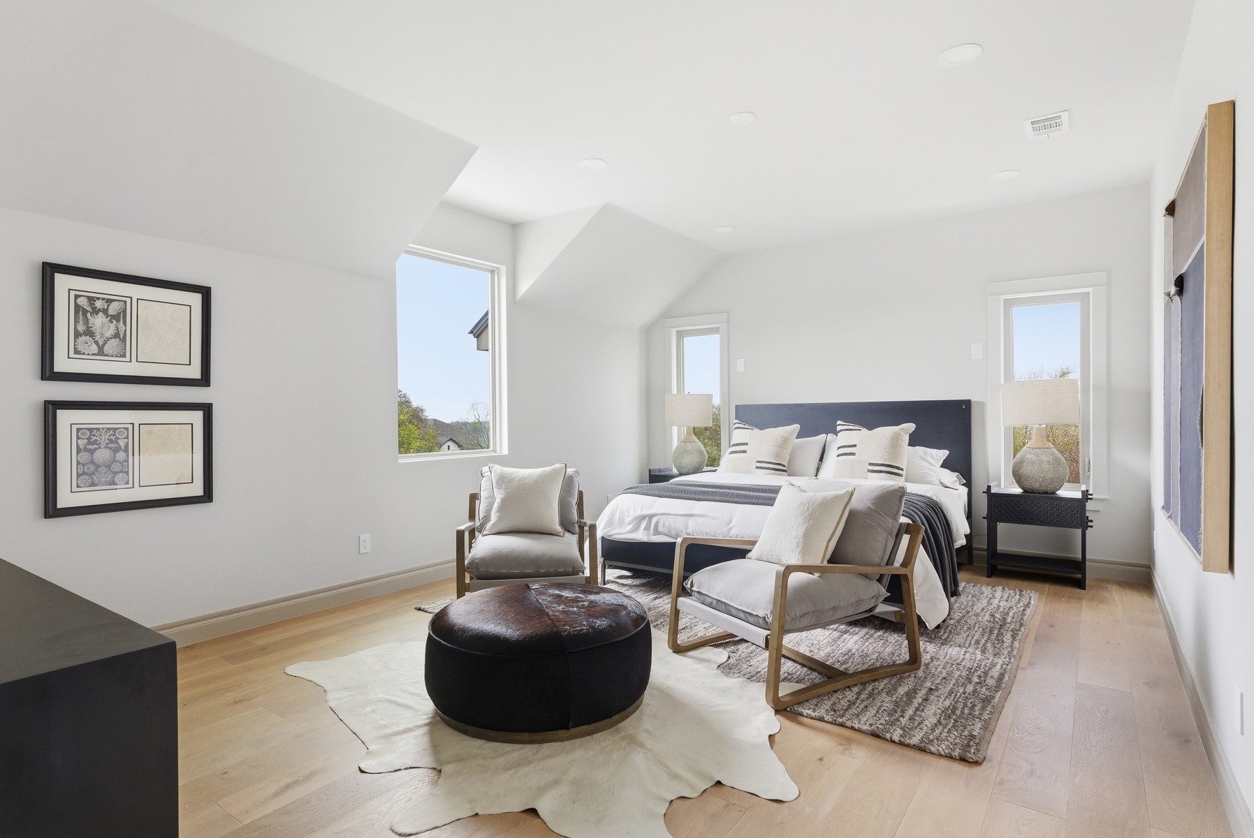 10259 Brangus Road Driftwood, TX 78619 - Photo 26 of 39 a bedroom with furniture and a couch