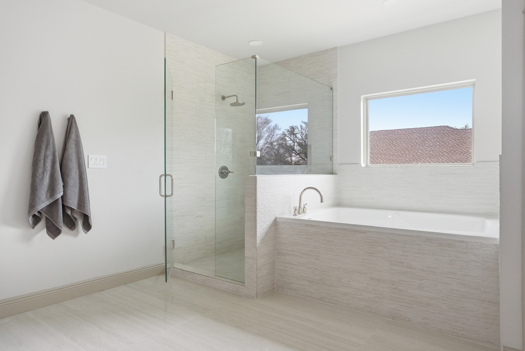 10259 Brangus Road Driftwood, TX 78619 - Photo 29 of 39 a bathroom with a tub and a shower