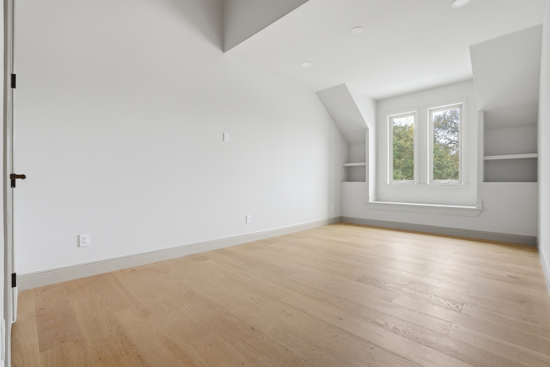 10259 Brangus Road Driftwood, TX 78619 - Photo 34 of 39 an empty room with wooden floor and windows