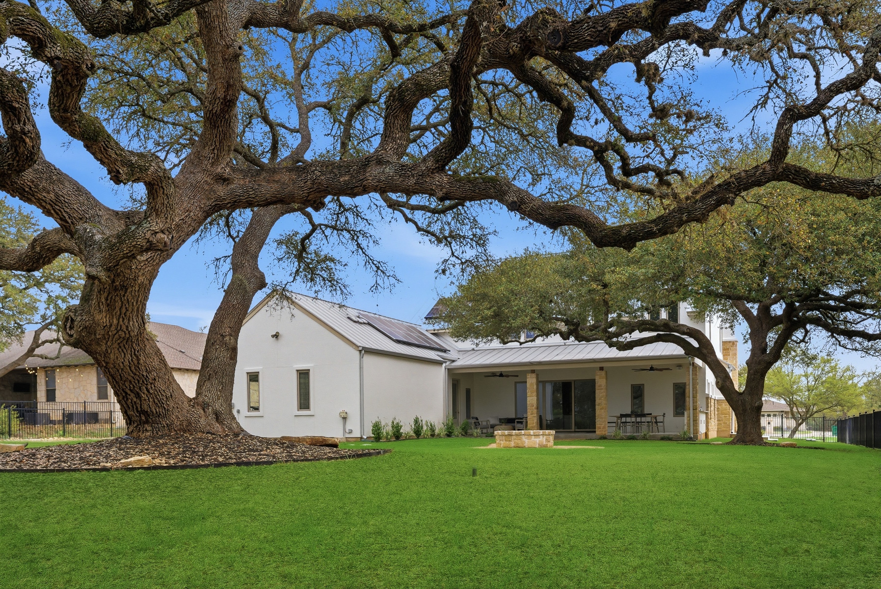 10259 Brangus Road Driftwood, TX 78619 - Photo 38 of 39 a front view of a house with a garden