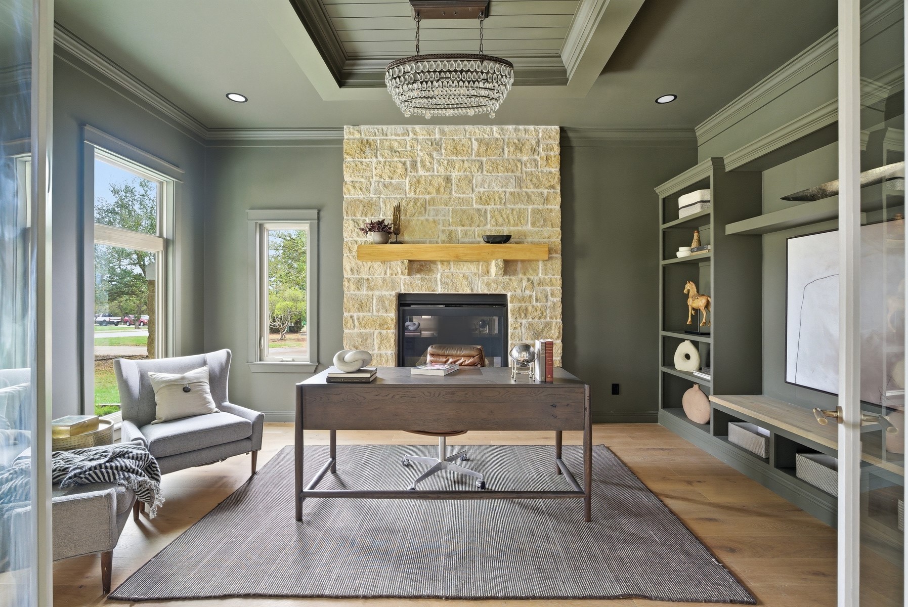 10259 Brangus Road Driftwood, TX 78619 - Photo 6 of 39 a living room with furniture and a fireplace