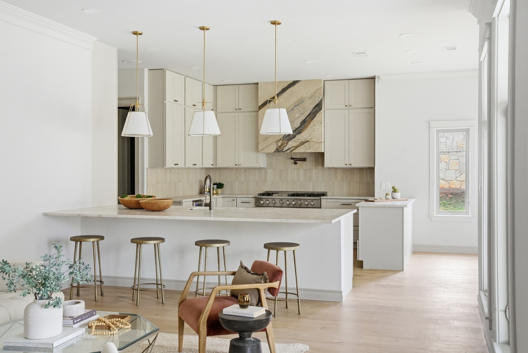 10259 Brangus Road Driftwood, TX 78619 - Photo 9 of 39 a kitchen with stainless steel appliances granite countertop a sink a stove and a refrigerator