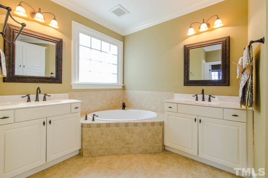305 Woodlief Farm Road Rolesville, NC 27571 - Photo 15 of 25 Two separate vanities , corner tub, separate walk-in shower, all ceramic Master Bath/Spa