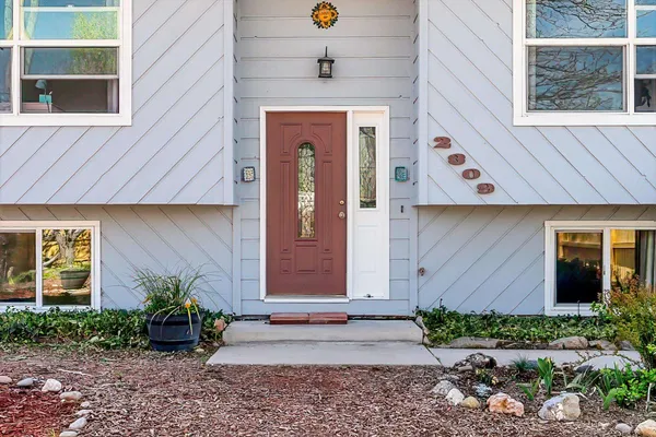 a front view of a house with garden