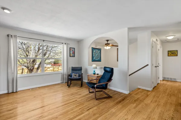 a workspace with wooden floor and a window