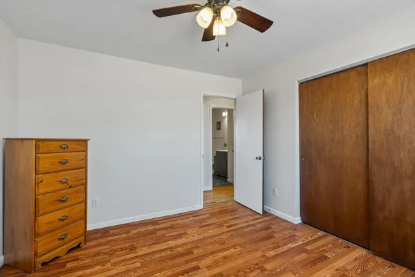 a view of a bedroom with a hardwood floor