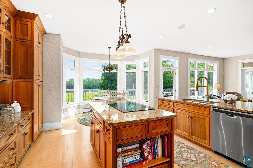 3168 Pioneer Road Barnum, MN 55707 - Photo 16 of 46 A cozy dining nook is where you'll enjoy your mornings and lunches, soaking in the sun and the views. Granite countertops and a baker's counter... there is nothing missing for the chef in the family.