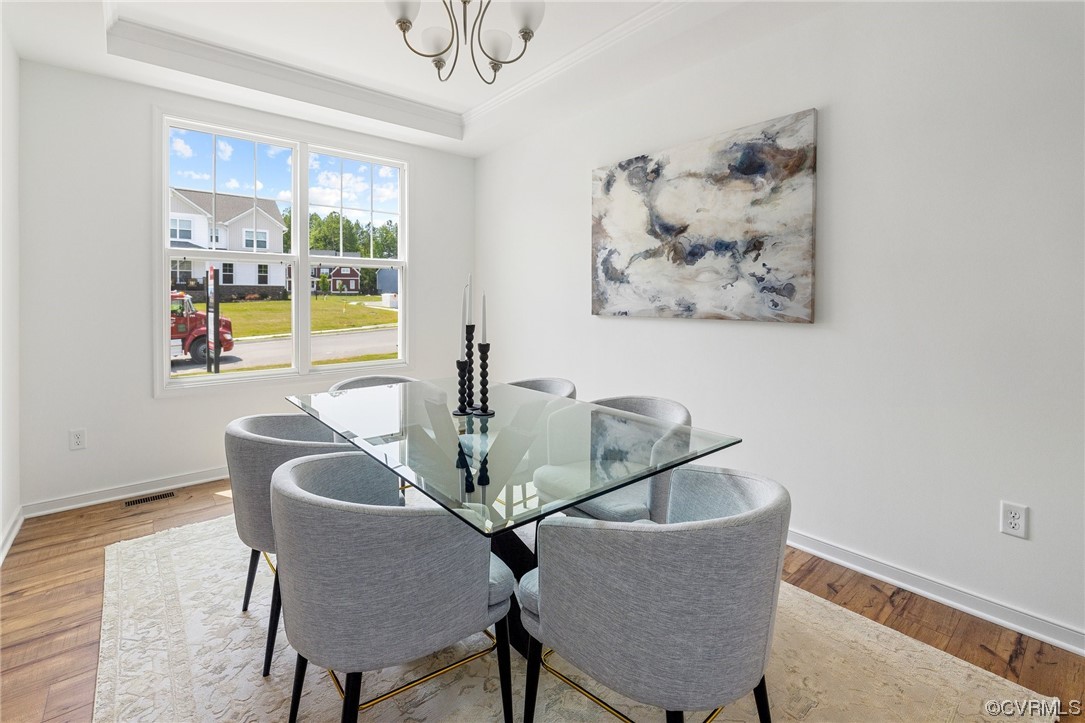 9118 Copplestone Road Chesterfield, VA 23832 - Photo 12 of 48 a dining room with furniture and a floor to ceiling window
