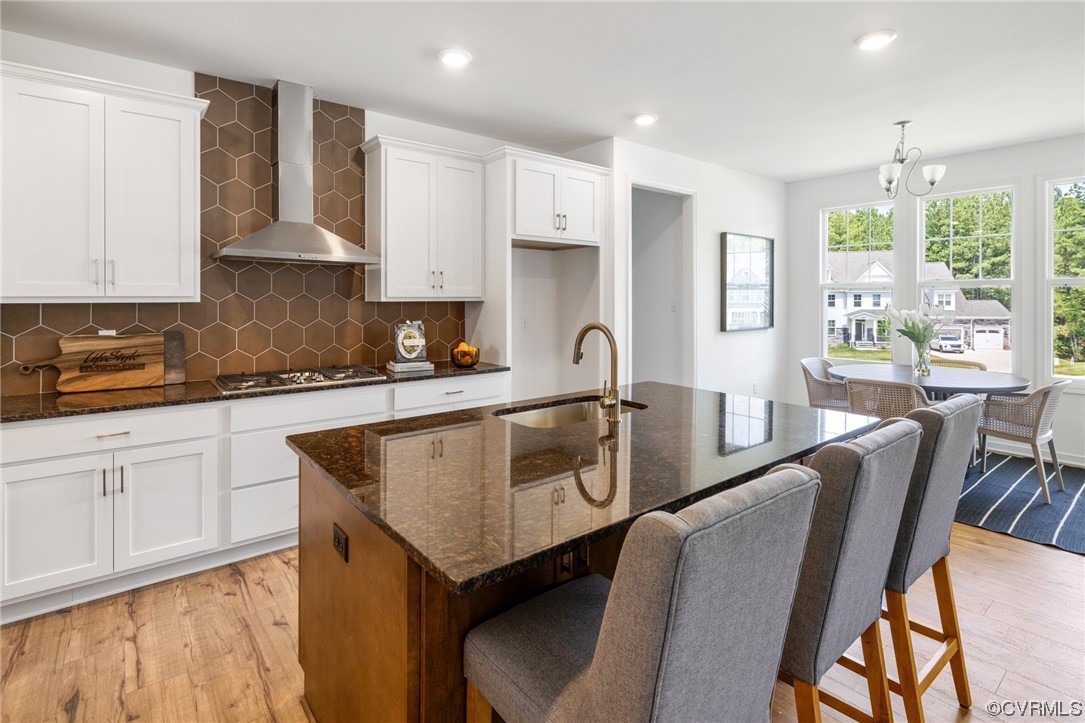 9118 Copplestone Road Chesterfield, VA 23832 - Photo 18 of 48 a kitchen with stainless steel appliances granite countertop a table chairs sink and cabinets