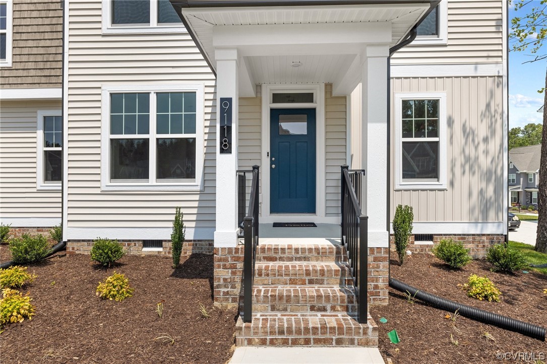9118 Copplestone Road Chesterfield, VA 23832 - Photo 2 of 48 a front view of a house with a yard