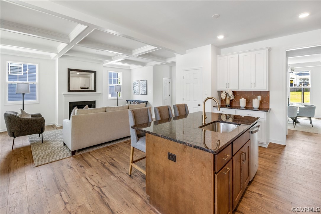 9118 Copplestone Road Chesterfield, VA 23832 - Photo 22 of 48 a kitchen that has a sink and a wooden floor