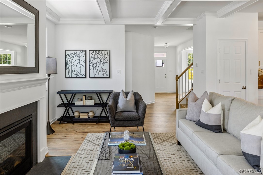 9118 Copplestone Road Chesterfield, VA 23832 - Photo 27 of 48 a living room with furniture and a fireplace