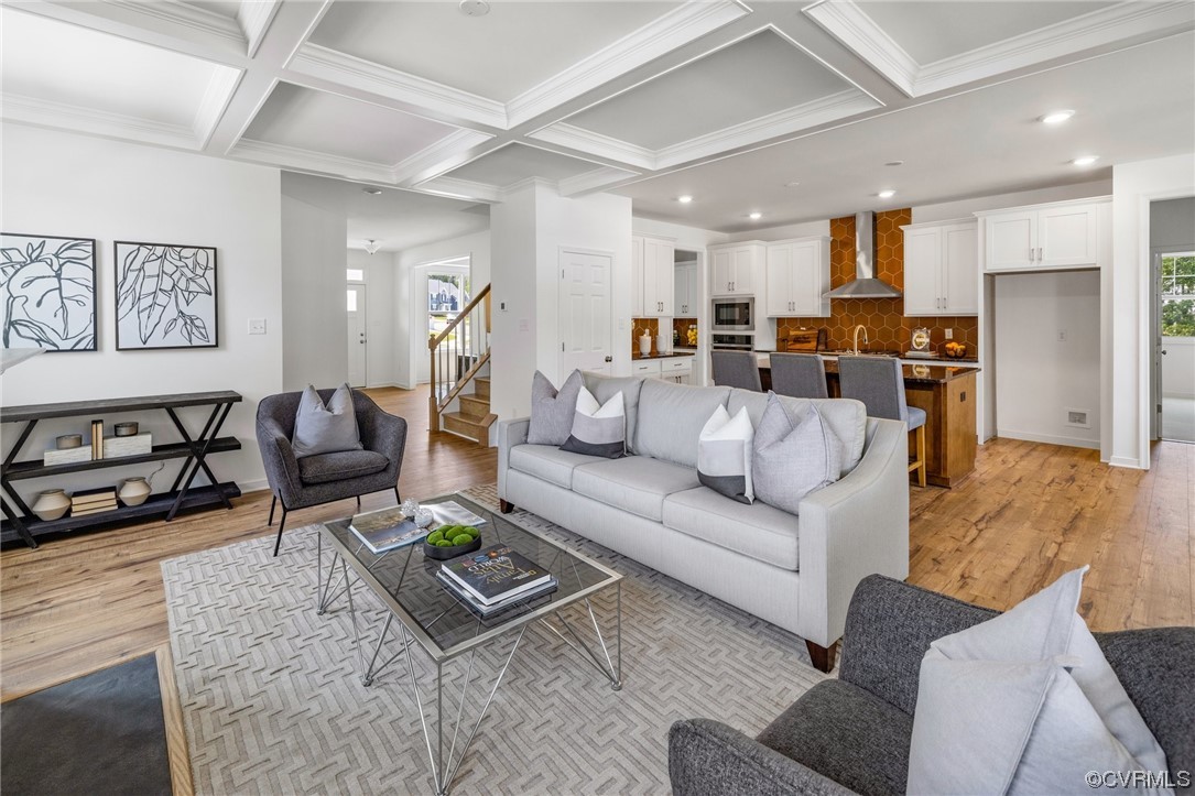 9118 Copplestone Road Chesterfield, VA 23832 - Photo 28 of 48 a living room with furniture kitchen view and a chandelier
