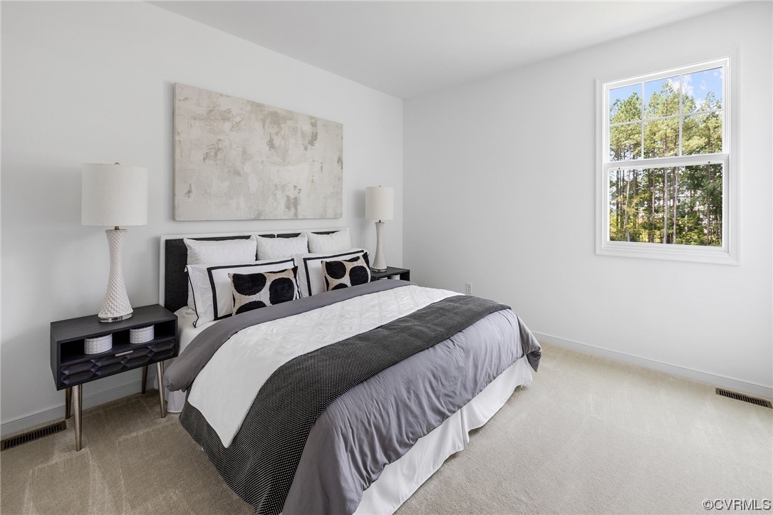 9118 Copplestone Road Chesterfield, VA 23832 - Photo 30 of 48 a bedroom with bed and a window