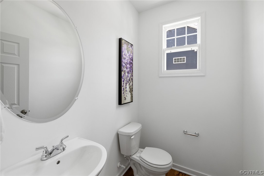 9118 Copplestone Road Chesterfield, VA 23832 - Photo 31 of 48 a bathroom with a toilet sink and mirror