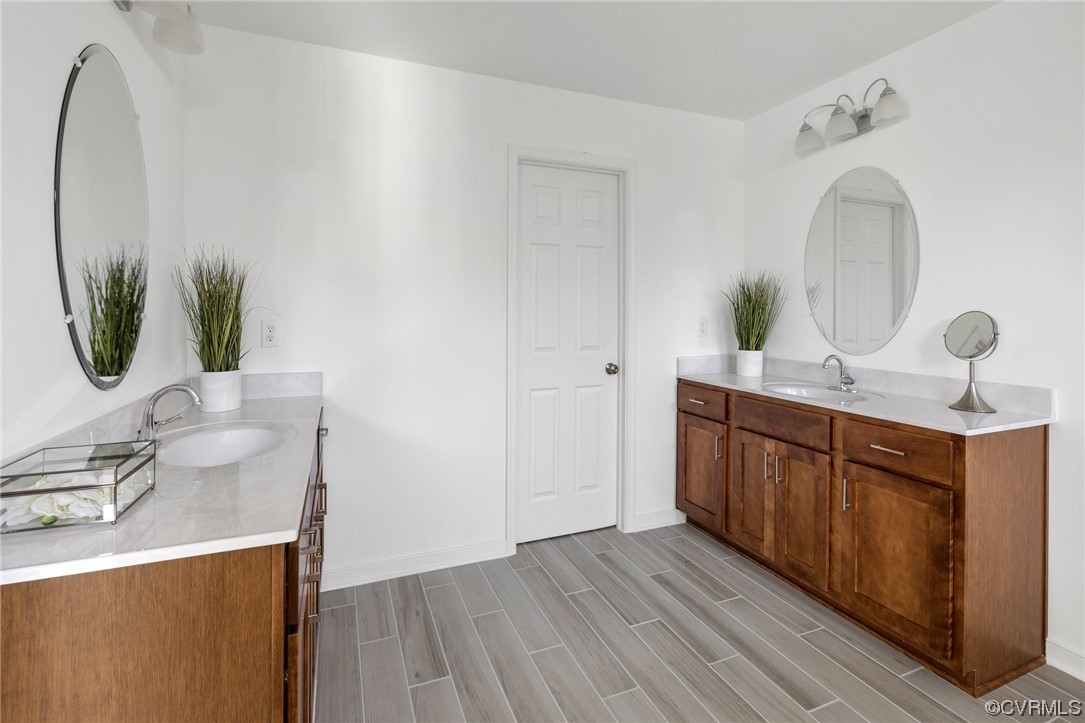 9118 Copplestone Road Chesterfield, VA 23832 - Photo 34 of 48 a bathroom with a sink and a mirror