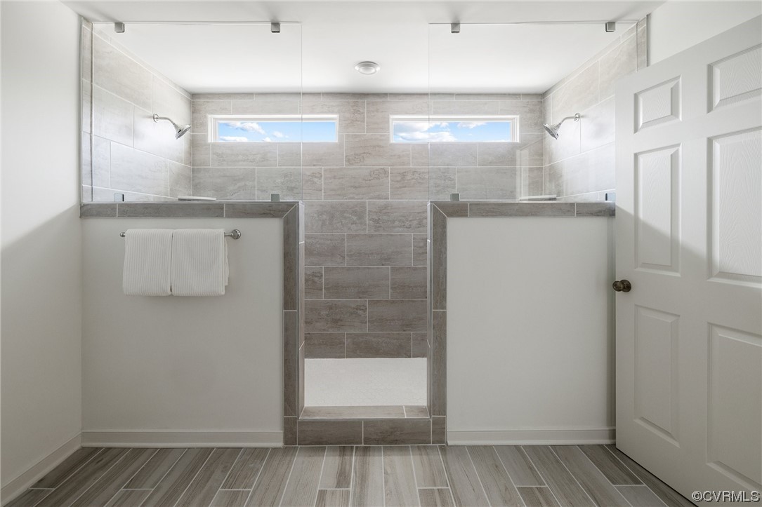 9118 Copplestone Road Chesterfield, VA 23832 - Photo 36 of 48 a bathroom with a shower and a glass door