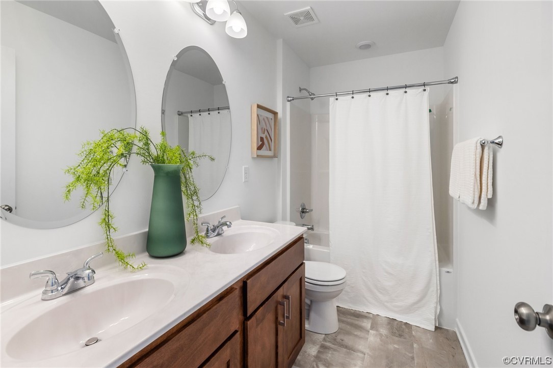 9118 Copplestone Road Chesterfield, VA 23832 - Photo 40 of 48 a bathroom with a granite countertop sink a toilet and shower