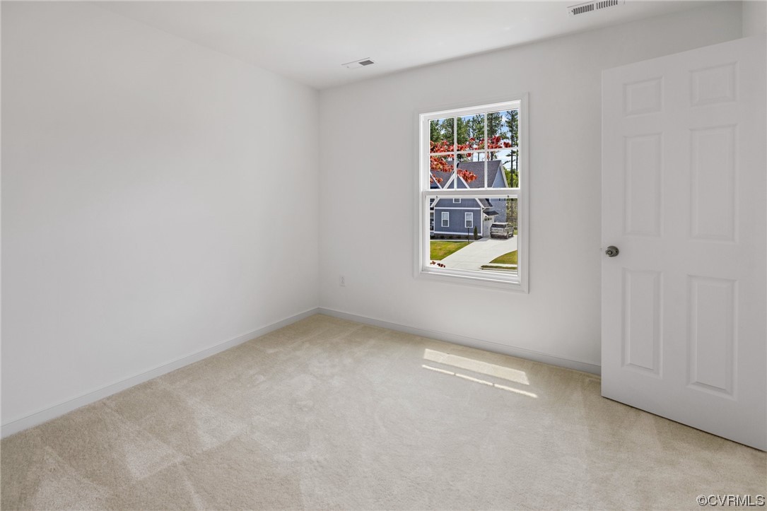 9118 Copplestone Road Chesterfield, VA 23832 - Photo 43 of 48 an empty room with windows