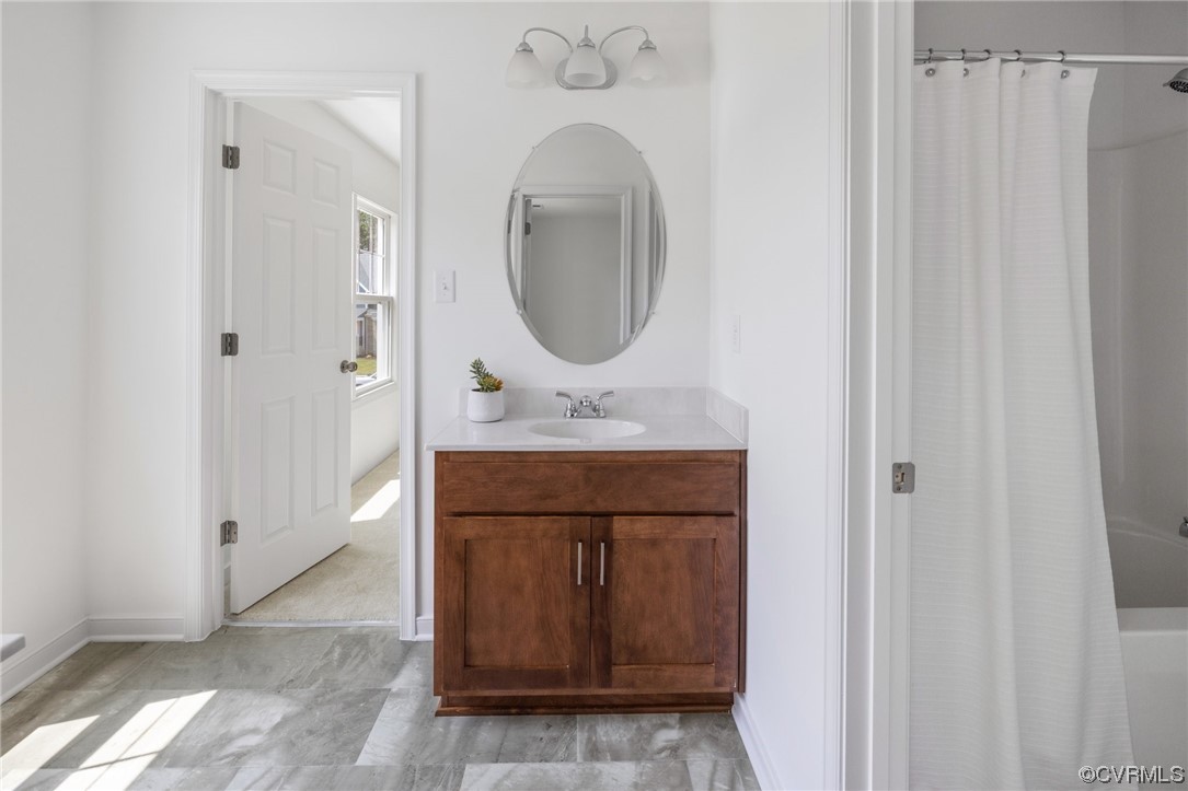 9118 Copplestone Road Chesterfield, VA 23832 - Photo 44 of 48 a bathroom with a sink and a mirror