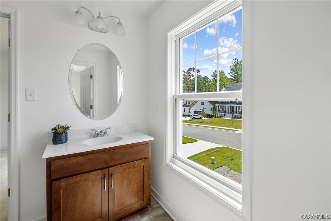 9118 Copplestone Road Chesterfield, VA 23832 - Photo 45 of 48 a bathroom with a sink and a mirror
