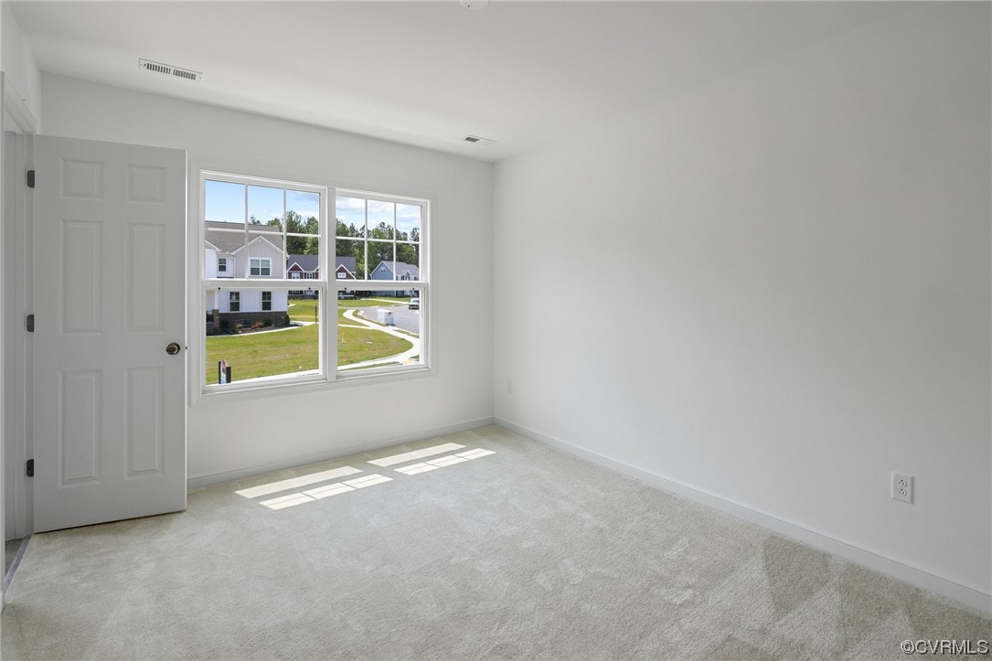 9118 Copplestone Road Chesterfield, VA 23832 - Photo 46 of 48 an empty room with glass door and a window